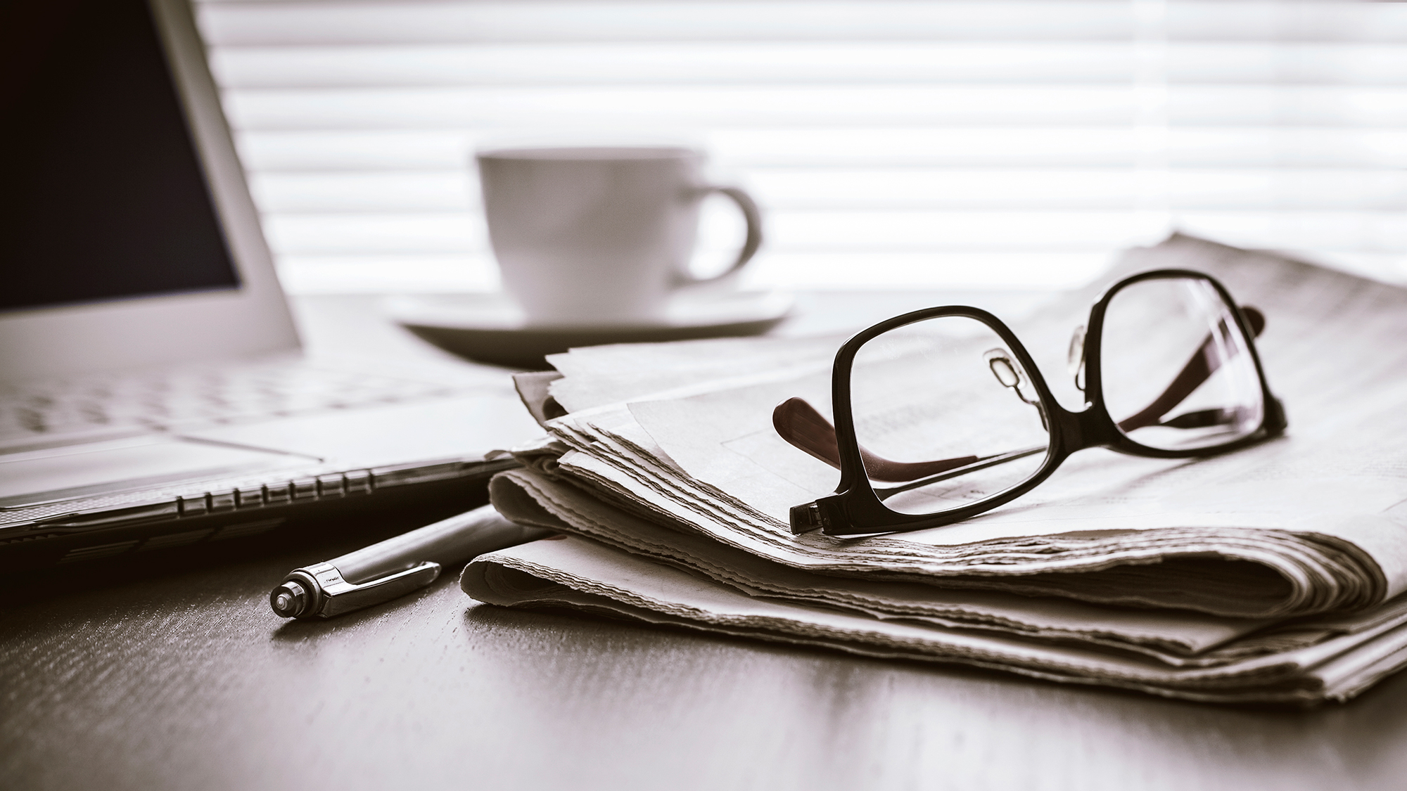 Glasses over paper news