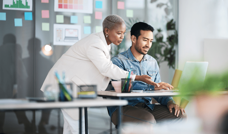 Two people chatting in an office